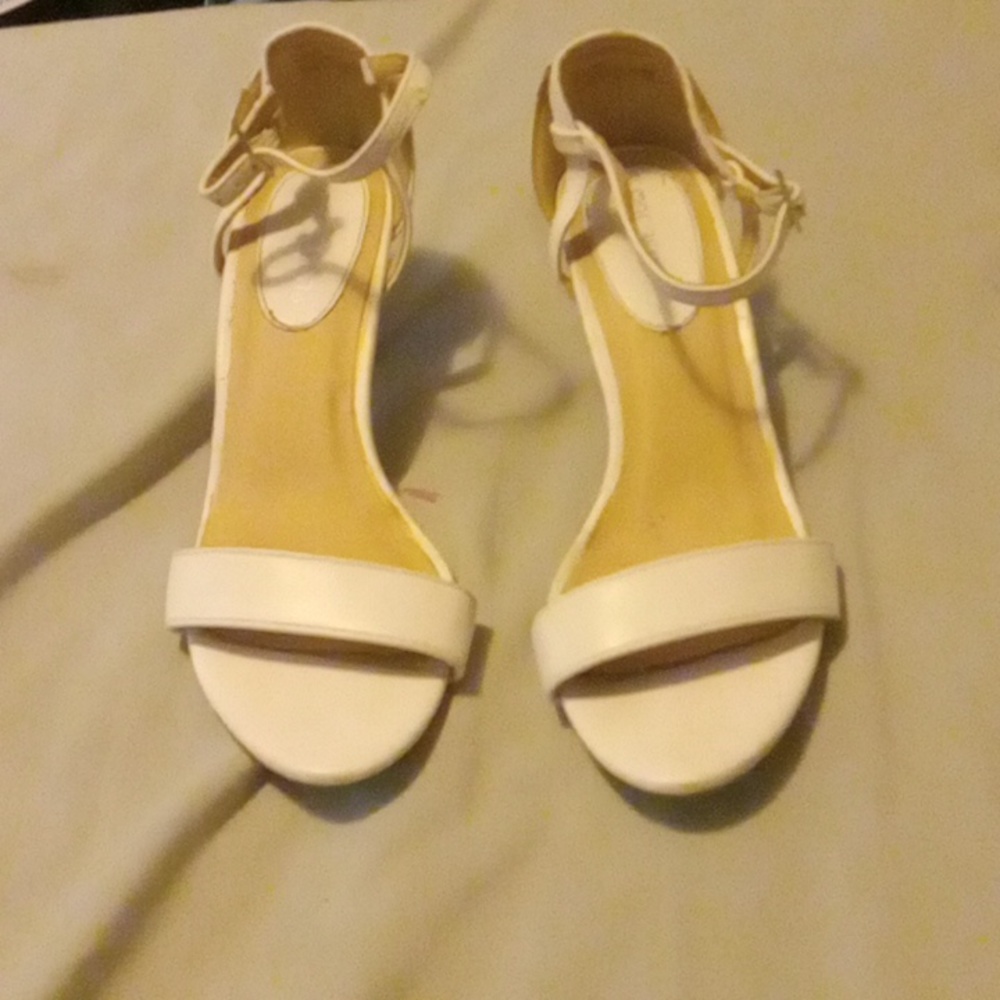 I am selling white high heels. They are from the brand Marbella.